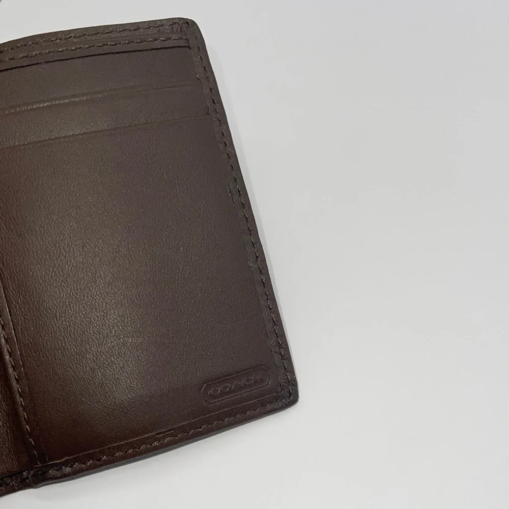 Coach Signature Embossed Trifold Wallet